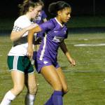 Kamora McMillian keeps her defender at bay as she makes a pass to her teammate against Port Angeles. (Mark Krulish/Kitsap News Group)