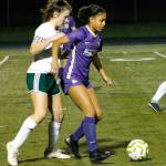 Kamora McMillian keeps her defender at bay as she makes a pass to her teammate against Port Angeles. (Mark Krulish/Kitsap News Group)