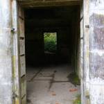 A long-abandoned storage facility for munition remote controls stands resolutely against the weather despite having had its windows and doors removed decades ago. (Bob Smith | Kitsap Daily News)
