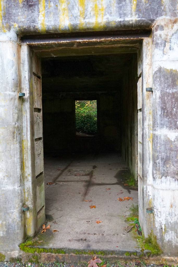 A long-abandoned storage facility for munition remote controls stands resolutely against the weather despite having had its windows and doors removed decades ago. (Bob Smith | Kitsap Daily News)