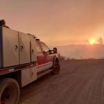 Firefighters from the South Puget Sound region, including those from Kitsap County, look on at The Ranch Fire blaze that is consuming dry acreage near Red Bluff, California. (South Puget Sound Strike Team photo)