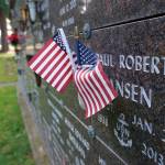 Cemeteries containing the remains of honored veterans  including Sunset Lane Memorial Park in Port Orchard  were visited by somber family members on this quiet Monday afternoon who left miniature flags and small stars-and-stripes-adorned balloons next to the plaques and monuments of their loved ones who served the nation at some point of their lives. (Bob Smith | Kitsap Daily News)