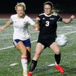 Klahowyas Sarah Newhard battles with a Lynden Christian player for the ball during their state tournament game. (Mark Krulish/Kitsap News Group)