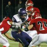 North Kitsap running back Taylor Jackson tries to maneuver through the Archbishop Murphy defense. The Wildcats won 46-0. (Mark Krulish/Kitsap News Group)