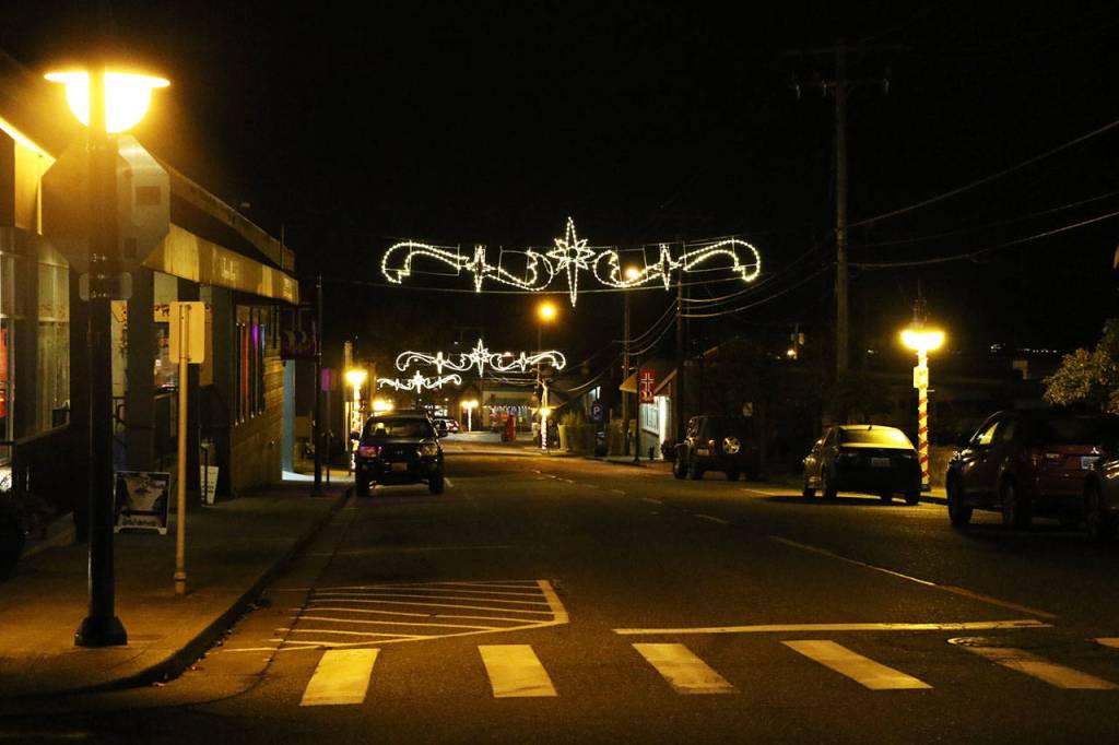 Banners of lights hang above Jensen and Front streets
