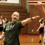 New girls basketball head coach CJ Scott helps his team practice contested shots a few days before their season-opener. Scott has been the volleyball coach at South Kitsap since 2013 and is a 1989 SK grad. (Mark Krulish/Kitsap News Group)