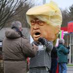 Bobby Salazar dressed as a Trump bobblehead and took pictures with other protesters.