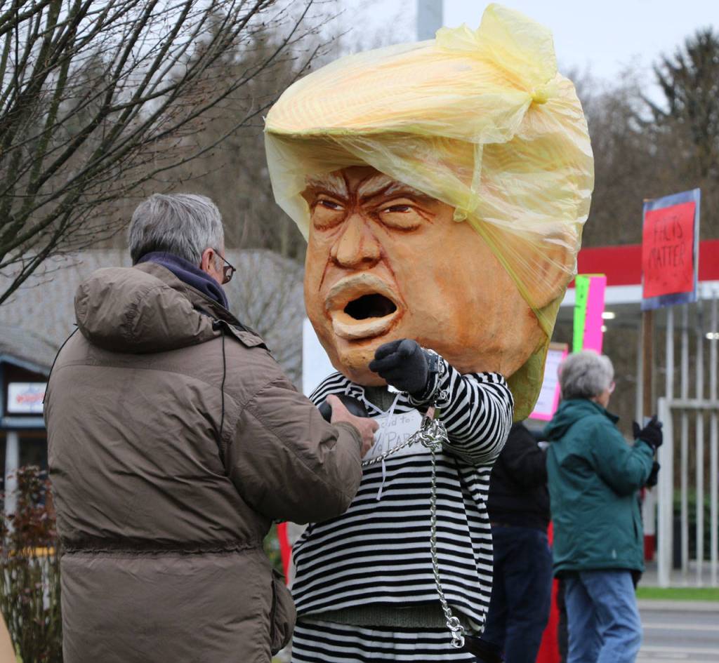 Bobby Salazar dressed as a Trump bobblehead and took pictures with other protesters.