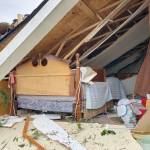 Furnishings from the bedroom of a home destroyed by a tornado lay bare to the elements. (Robert Zollna | Kitsap Daily News 2018)