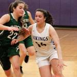 Noelani Barreith tries to get around Port Angeless Eve Burke (22) in the Vikings 67-39 loss. Barreith led the team with 12 points. (Mark Krulish/Kitsap News Group)