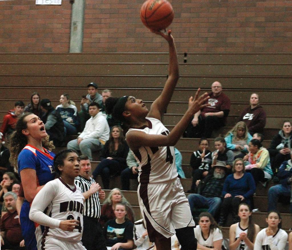 Mark Krulish | Kitsap News Group                                Kiki Prudhomme gets up and over the Graham-Kapowsin defense for a layup.