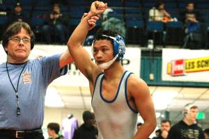 Olympics Anjelo Pangelinan took home a championship at 113 after pinning his first three opponents and then winning a major decision in the finals. (Mark Krulish/Kitsap News Group)
