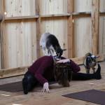 A goat climbs atop a yoga instructor during a goat yoga class at Smithshyre Farm. Ken Park / Kitsap News Group