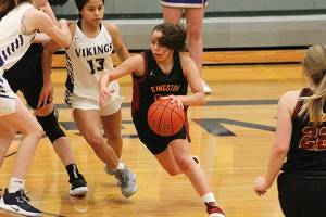 Kingston senior Leetsah Deam looks to dribble through the defense of North Kitsaps Kamora McMillan (13) and Riley Rabedeaux. (Mark Krulish/Kitsap News Group)