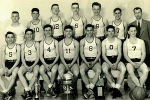The 1948 Bainbridge boys state championship basketball team is one of two teams to be inducted into the Kitsap Athletic Roundtables Kitsap Sports Hall of Fame. Back row: Bob Dixon, Pete Uglesich, Bob Woodman, Jack Start, Bob Olsen, Ray Lowrie, Coach Tom Paski. Front row: Bob Sigle, Bob Buchanan, Dale Wallace, Don Nadeau, Jim Nadeau, Don Barnes, Sam Clarke. (Photo courtesy KAR)