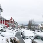 The snow contrasts the colorful homes along Jensen Street.
