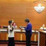 Mayor Erickson swears in new council members Britt Livdahl and Andrew Phillips. (Photos by Ken Park)