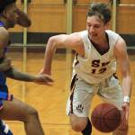 Eli Mackie looks to drive past a Graham-Kapowsin defender in South Kitsaps 68-61 win on Wednesday night. Mackie finished the game with a team-high 16 points. (Mark Krulish/Kitsap News Group)