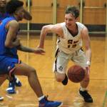 Eli Mackie looks to drive past a Graham-Kapowsin defender in South Kitsaps 68-61 win on Wednesday night. Mackie finished the game with a team-high 16 points. (Mark Krulish/Kitsap News Group)