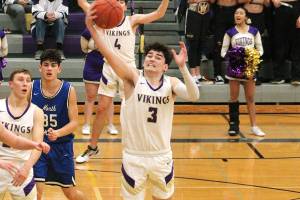 North Kitsaps Aiden Olmstead reaches out to grab a rebound in his teams 80-47 win over North Mason. (Mark Krulish/Kitsap News Group)