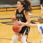 Mia McNair sidesteps the defense of North Masons Kirstin Griffey (15) in North Kitsaps final regular season game against the Bulldogs. (Mark Krulish/Kitsap News Group)