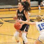 Mia McNair sidesteps the defense of North Masons Kirstin Griffey (15) in North Kitsaps final regular season game against the Bulldogs. (Mark Krulish/Kitsap News Group)