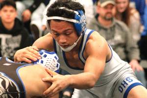 Olympic senior Anjelo Pangelinan won the 113 finals at the KingCo/Olympic 2A subregional on Saturday. (Mark Krulish/Kitsap News Group)