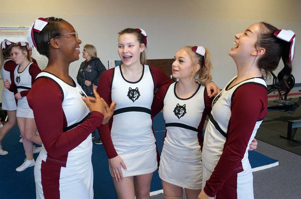 Serenity Gainey, Elle Matheson, Kianda Purdum and Makenzie Vanden Bos share a laugh during practice. (Bob Smith | Kitsap Daily News)