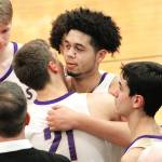 North Kitsap senior Shaa Humphrey is congratulated by his teammates after reaching the 1,000-point milestone in his teams district win over Steilacoom. (Mark Krulish/Kitsap News Group)