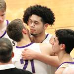 North Kitsap senior Shaa Humphrey is congratulated by his teammates after reaching the 1,000-point milestone in his teams district win over Steilacoom. (Mark Krulish/Kitsap News Group)