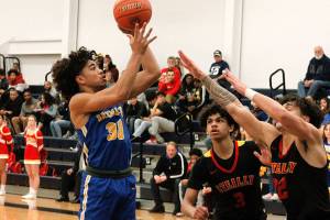 Kimo Retome gets a shot up and over the Steilacoom defense in Bremertons 54-52 win on Wednesday. (Mark Krulish/Kitsap News Group)