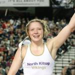 Holly Beaudoin with her arm raised by the referee after she became a state champion at the Mat Classic. (Mark Krulish/Kitsap News Group)