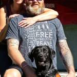 Service dog Pintler, an 8-year-old black Lab, is an important part of Keith Sekoras life (standing next to his wife Andrea). (Photo courtesy of Keith Sekora)