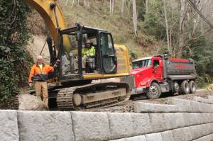 Kingston neighbors work together to rebuild threatened road