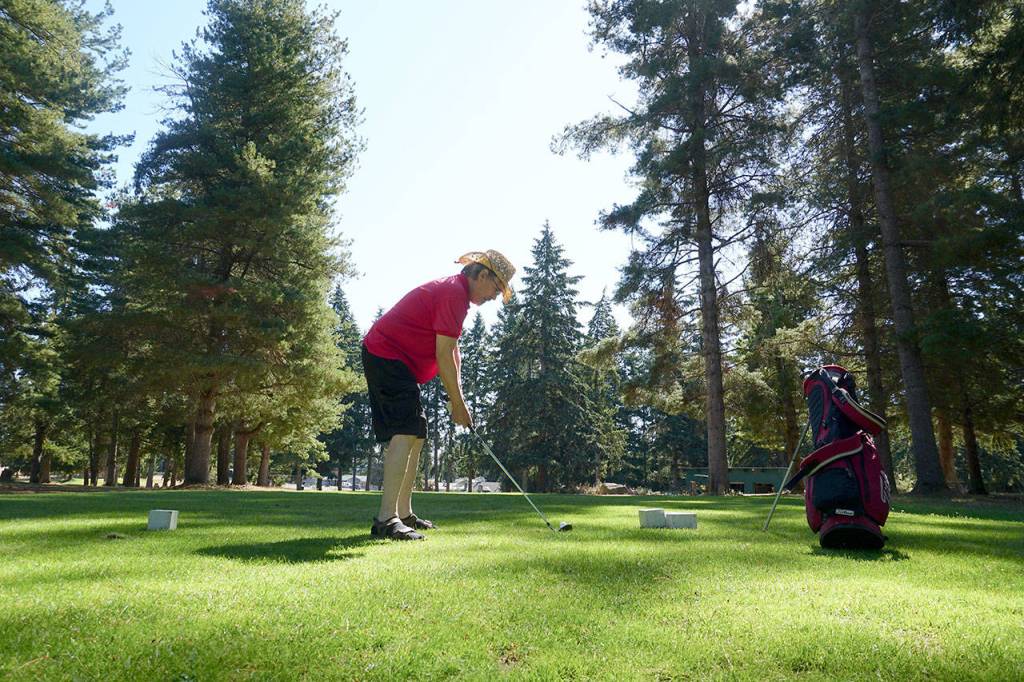 Karsten Boysen of Port Orchard tees off at Village Greens Golf Course. (Mike De Felice | Kitsap Daily News)