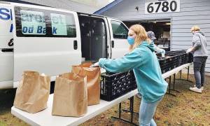 Volunteers get food ready at ShareNet. Courtesy photo