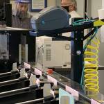 Election ballots that have arrived at Kitsap Countys Election Division are fed through a sorting machine on Monday. (Bob Smith | Kitsap Daily News)