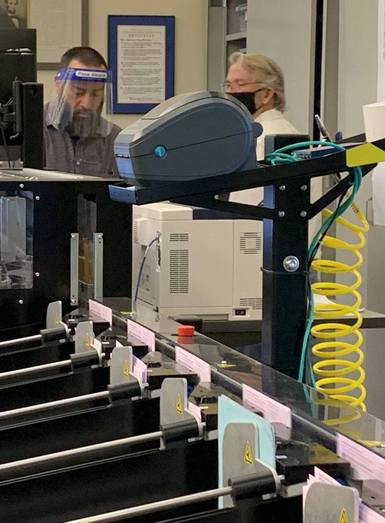 Election ballots that have arrived at Kitsap Countys Election Division are fed through a sorting machine on Monday. (Bob Smith | Kitsap Daily News)