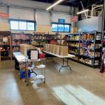 Fishline executive director Lori Maxim shows where delivery packages are staged.