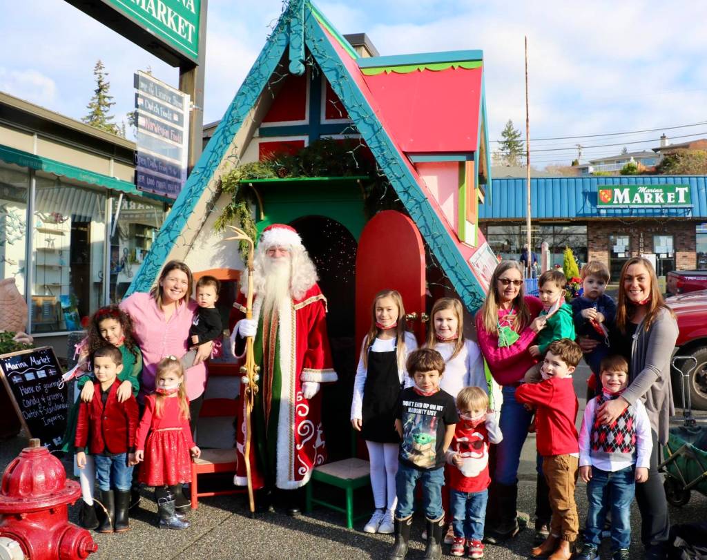 Children ranging in age from 2-10 years old spent the afternoon chatting with Santa at his Poulsbo Cottage. KPark/NKH.