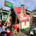 Children from Precious Blessings Pre-School and Day Care gathered outside Santa's Cottage, waiting their turn to meet the man in red. KPark/NKH