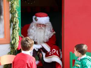 Santa chats with two boys about their Christmas wishes. KPark/NKH