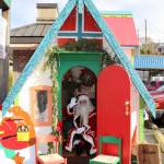 Santa waves from inside his hut. KPark/NKH