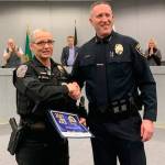 Sgt. Donna Main of the Port Orchard Police Department has been promoted to the agencys second-in-command position as deputy chief. In a photo taken last year, Main is congratulated for a service award by Chief Matt Brown at a Port Orchard City Council meeting. (File photo)
