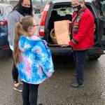 Sandi Fleurys baking business, called From the Garden to the Table, started in 2018 after she decided to leave the dentistry field. Here, she delivers orders to a mom and her daughter in Port Orchard. (Bob Smith | Kitsap Daily News)