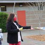 A Vinland staff member collects attestation slips from students.