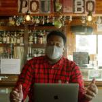 <em>Seattle Kraken radio voice Everett Fitzhugh takes a break at the Brass Kraken during a visit to Poulsbo. Below: A worker at Sluys Bakery in Poulsbo shows Fitzhugh a few of their tasty treats. </em>	 Photos courtesy Seattle Kraken