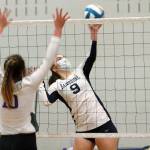 Bainbridge senior Lauren de Gall looks to send a spike past the North Kitsap defense. (Mark Krulish/Kitsap News Group)