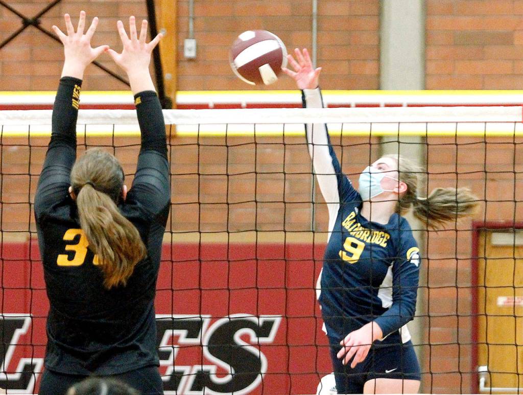 Bainbridge senior Lauren de Gall looks to put the ball past South Kitsaps Anna Harvey (39) in the Spartans three-set win Thursday. (Mark Krulish/Bainbridge Island Review)