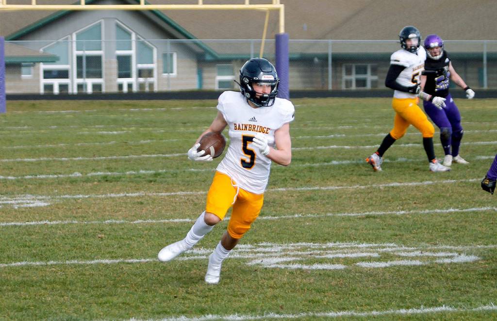 Cal Breen makes the reception and escapes into the open field against Sequim. (Mark Krulish/Kitsap News Group)